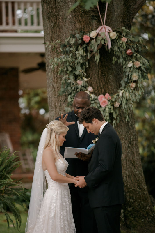 bride and grooms saying vows