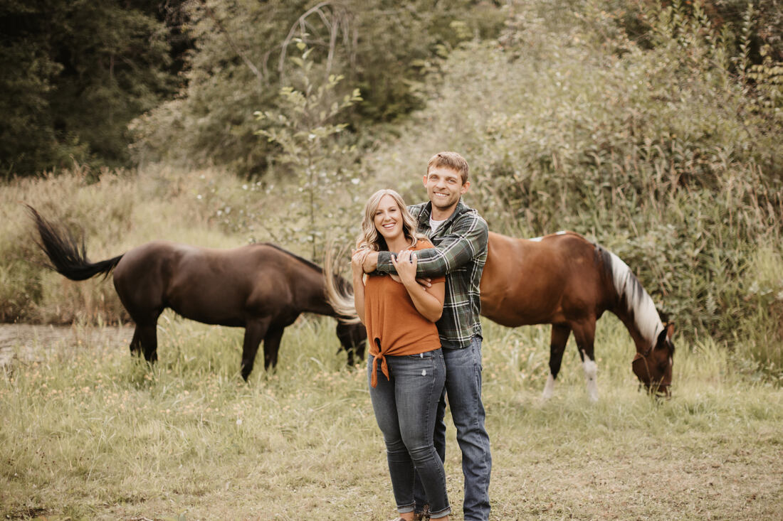 couple and their horses