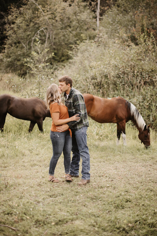 couple kissing on their farm