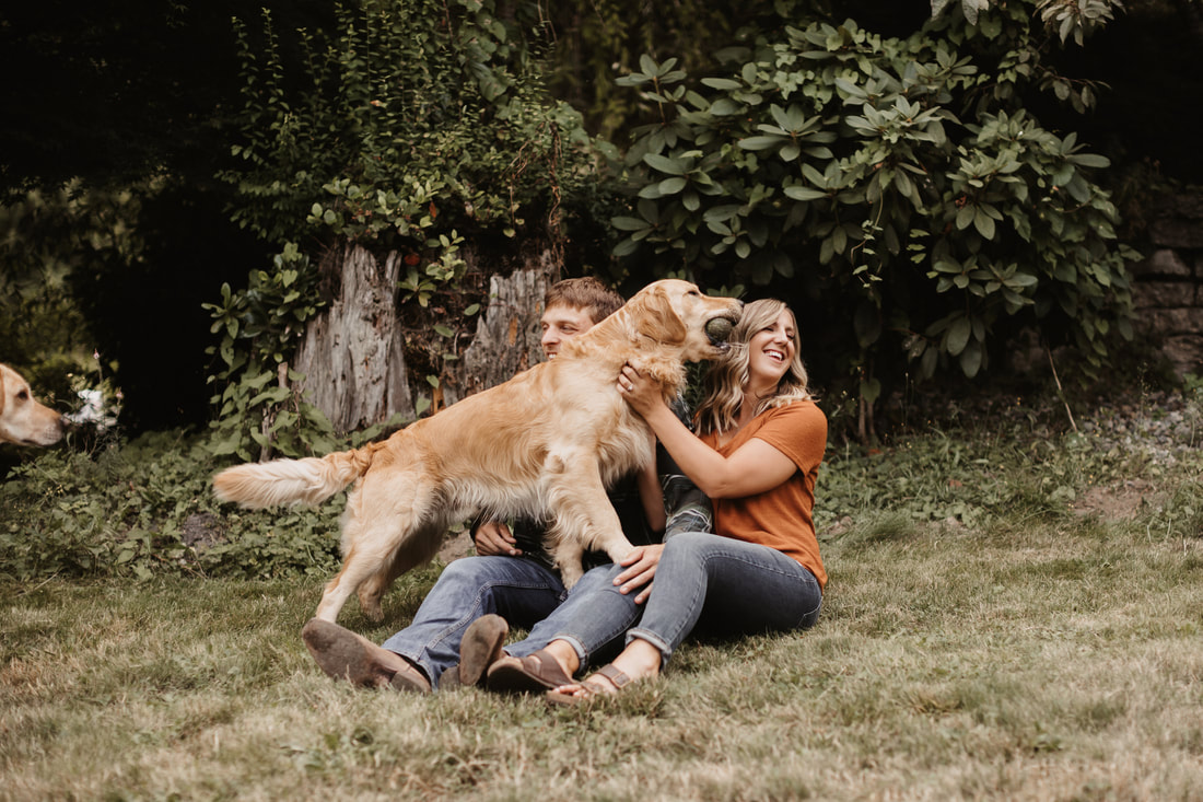 loving couple take photos with their dogs
